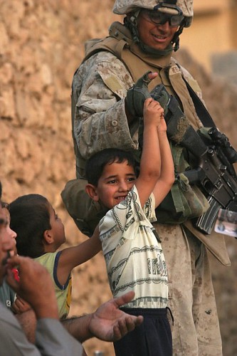 Soldier plays with Iraqi children