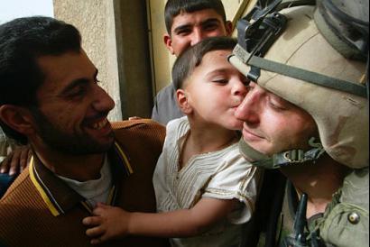 Iraqi Child Kisses US Solider