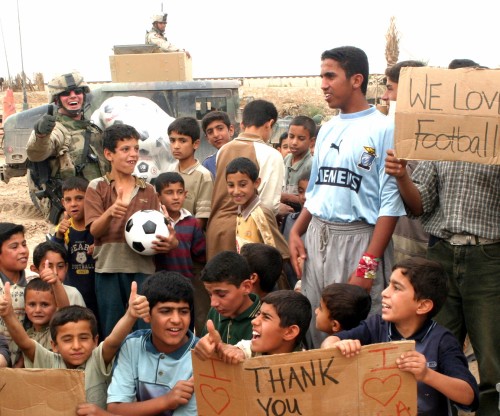 Soldier Iraqi children in Soccer Game
